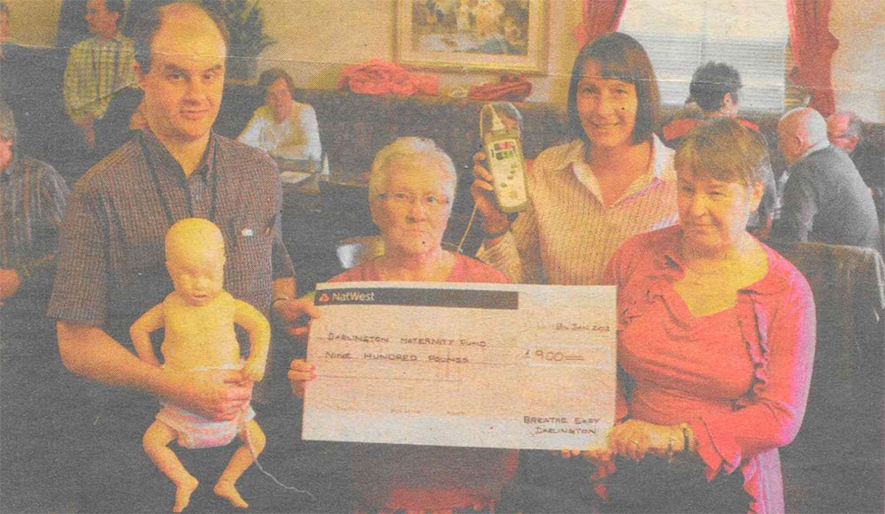 Breathe Easy Darlington presented a cheque for £900 to Dr John Furness